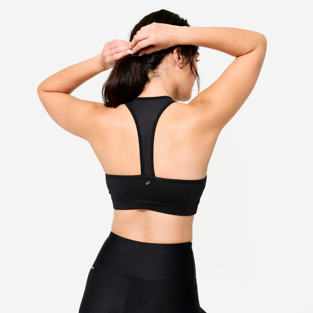 Top deportivo para fitness con soporte ligero para Mujer Domyos 100 negro