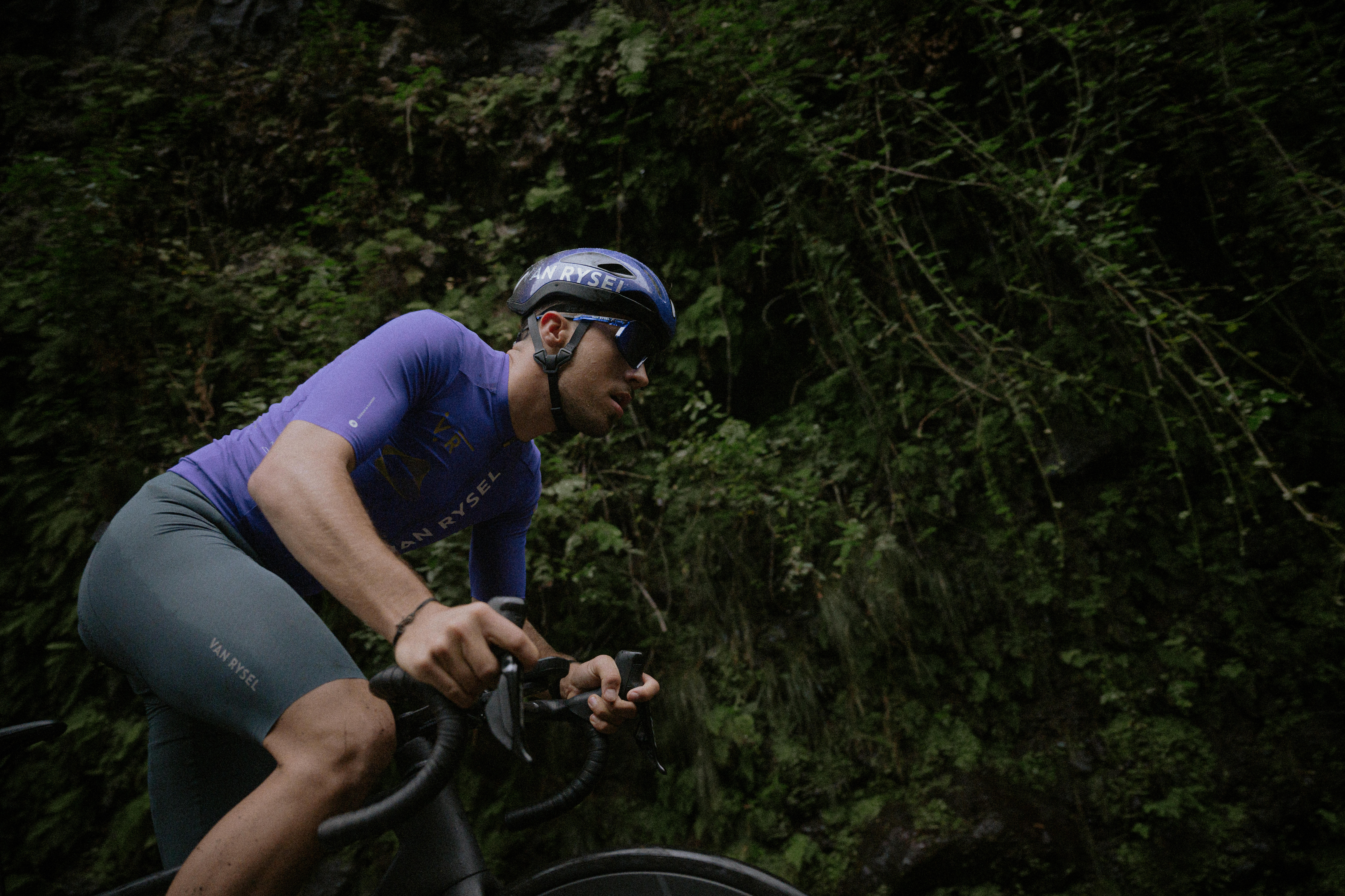 Cyclist wearing fitted cycling shorts while riding a road bike