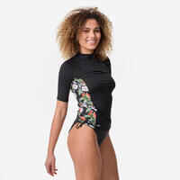 Women's UV-protective short sleeve T-shirt surf top 500 black and floral PARROT