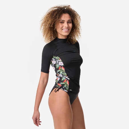 Women's UV-protective short sleeve T-shirt surf top 500 black and floral PARROT