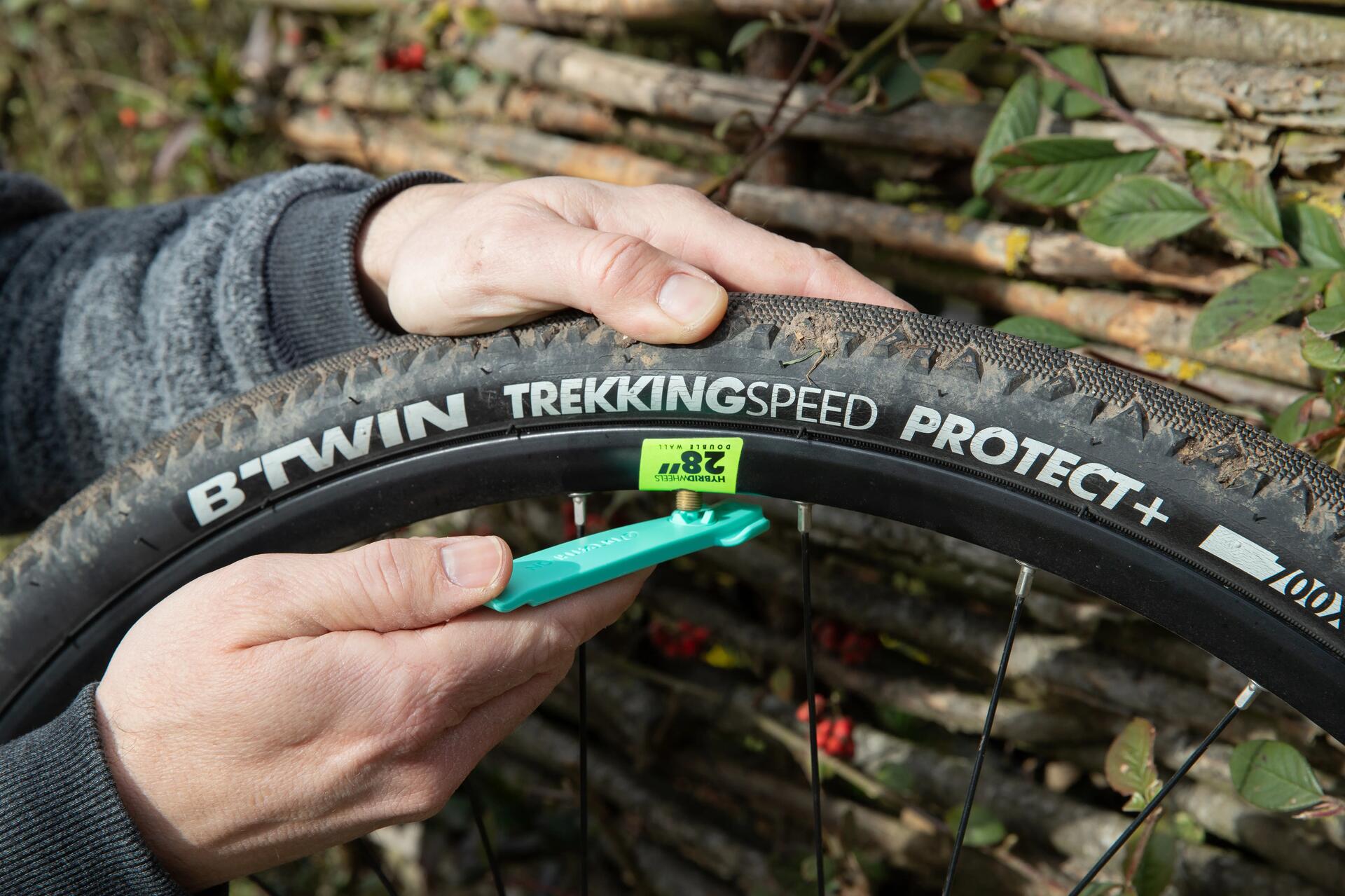 person changing a bike inner tube