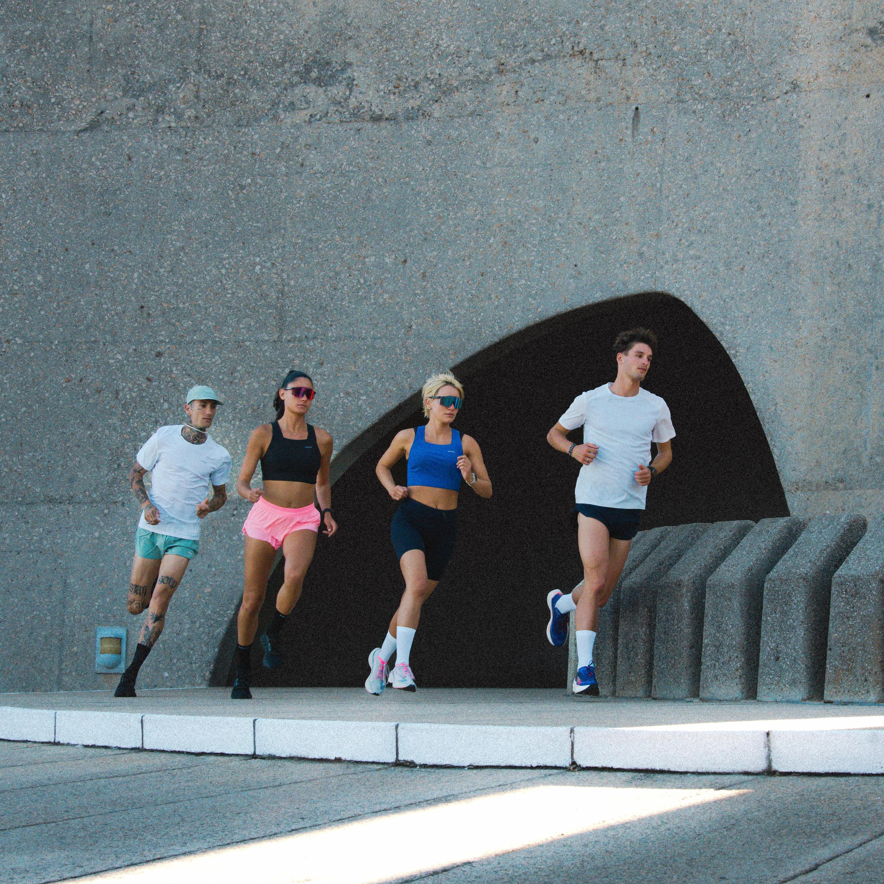 Two men and two women running 