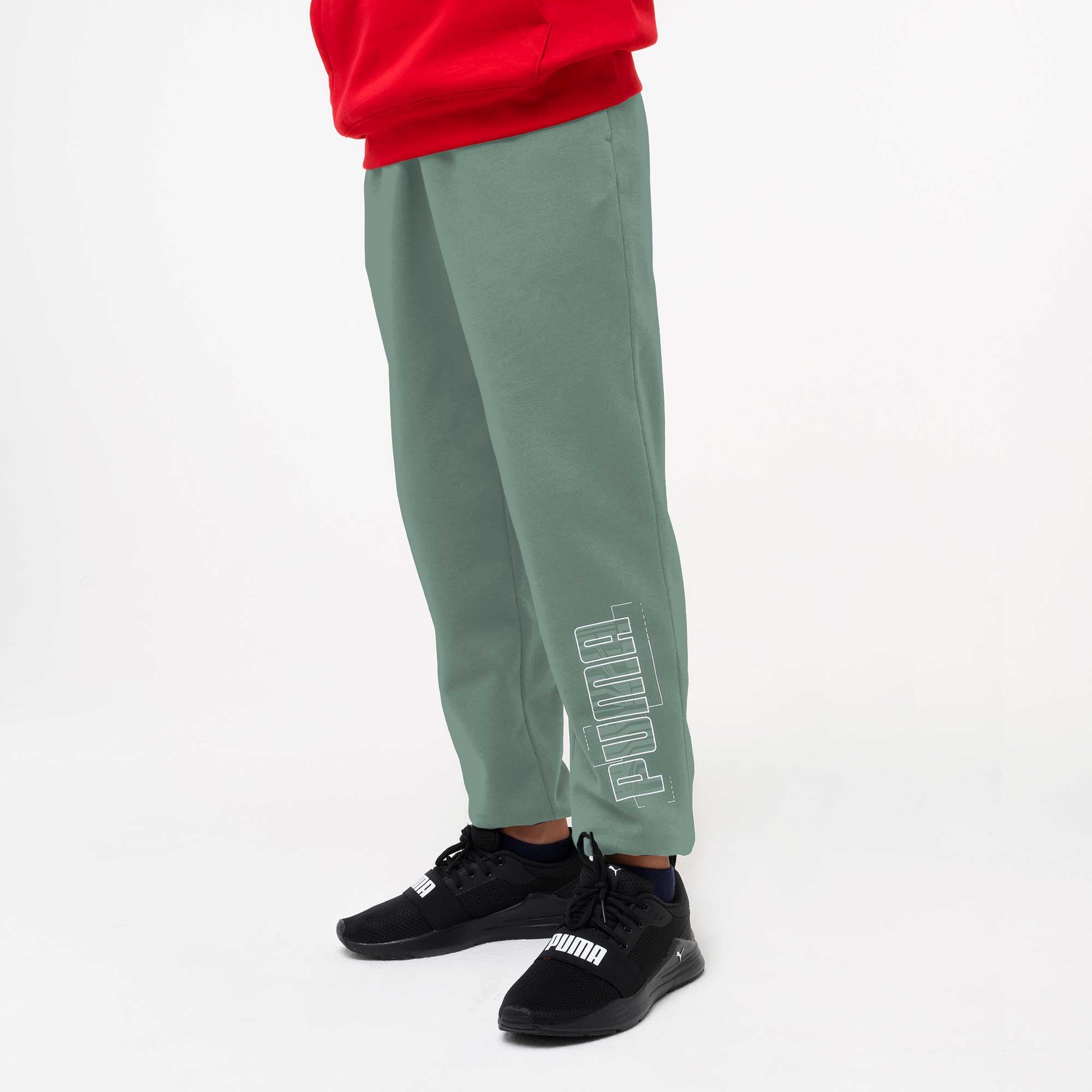 Pantaloni tuta Puma bambino ginnastica regular fit felpati verdi 3/6