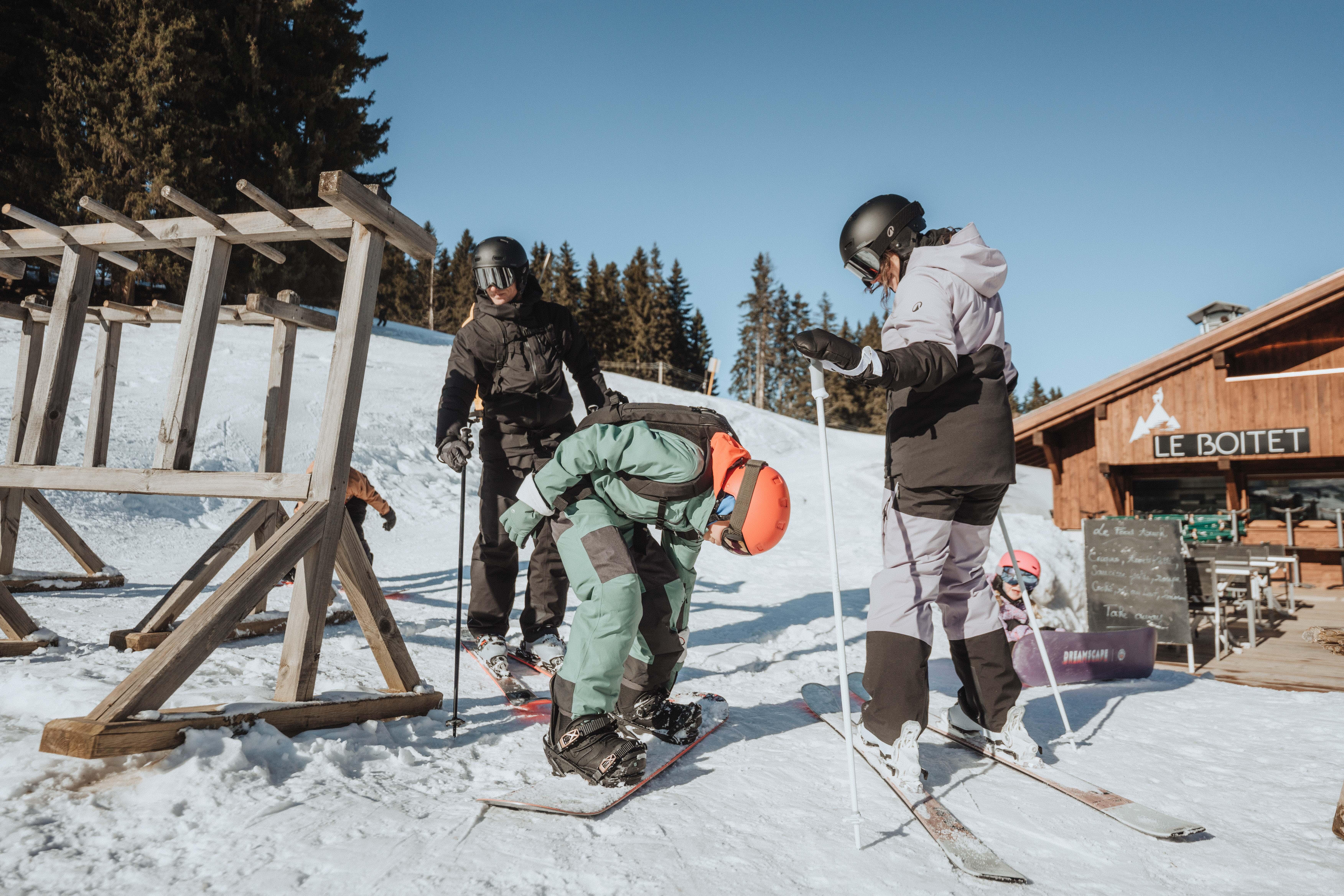Family preparing to ski on the slopes