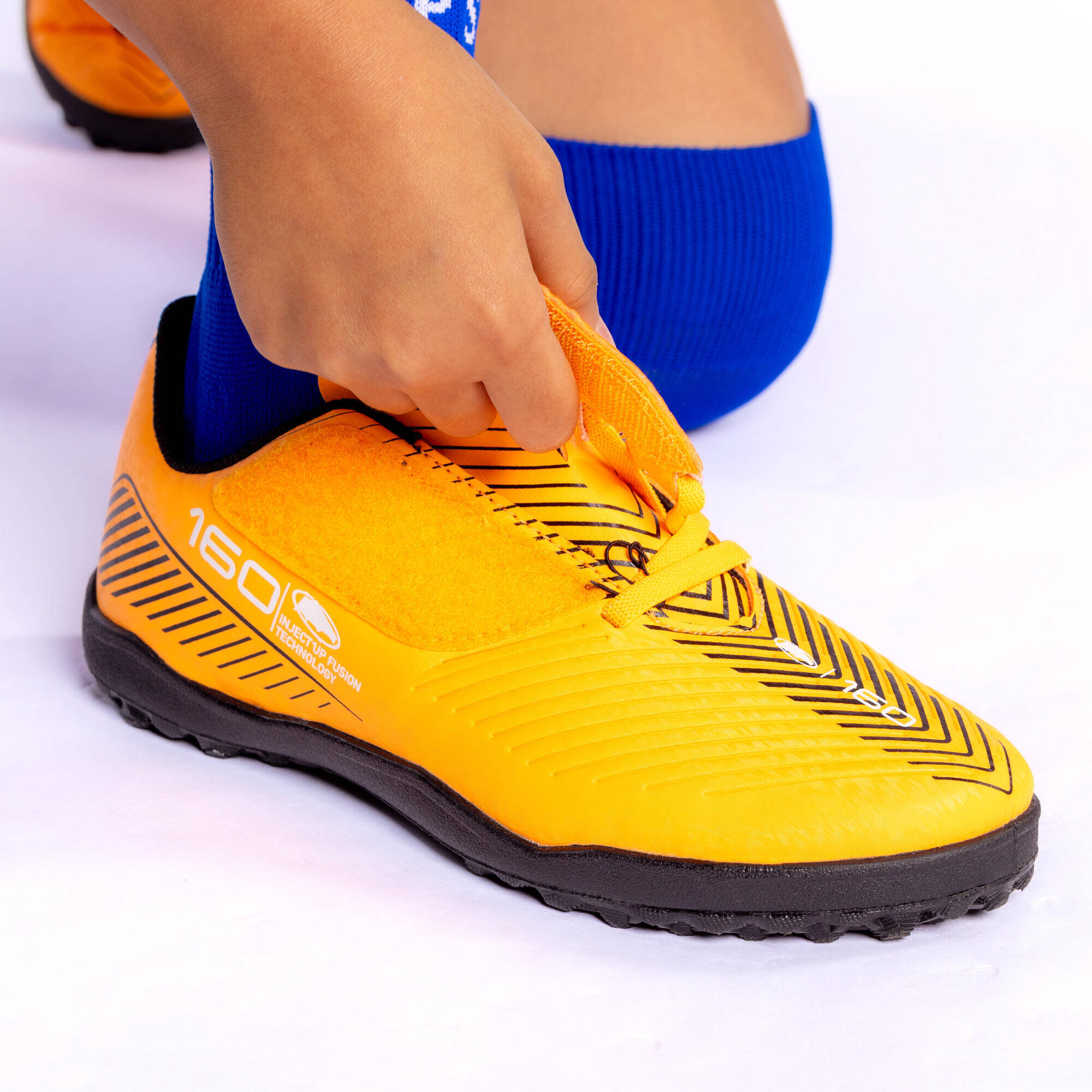 Kids' Turf Rip-Tab Football Boots 160 - Orange/Black -  1