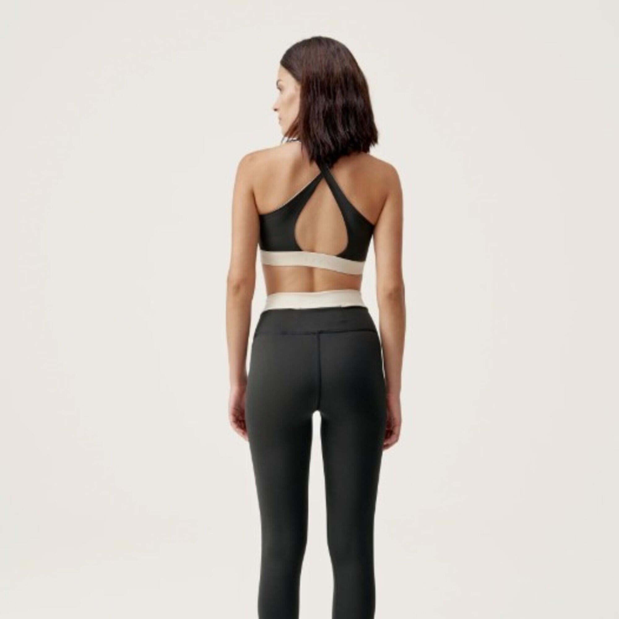Top deportivo sujeción media reversible Mujer Born living yoga Fiorella negro. 5/7