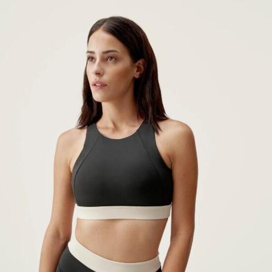 Top deportivo sujeción media reversible Mujer Born living yoga Fiorella negro.