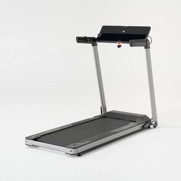 Compact running treadmill with handrails and a console