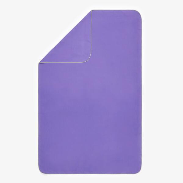 Purple compact microfibre towel rolled up