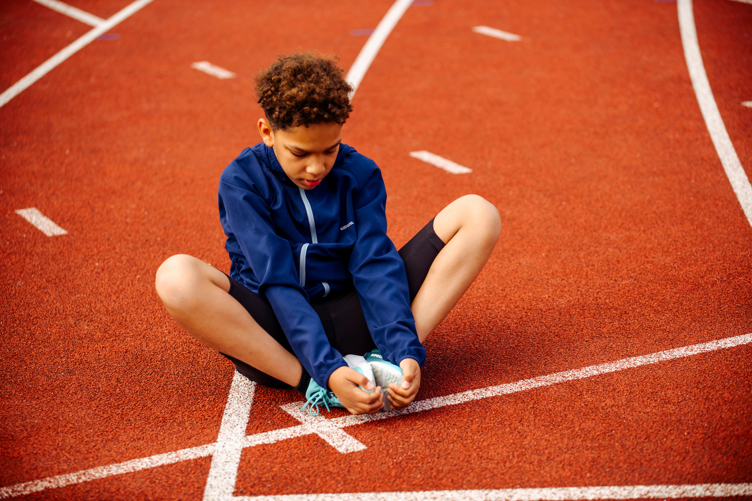 Windjack voor hardlopen kinderen marineblauw 10/13