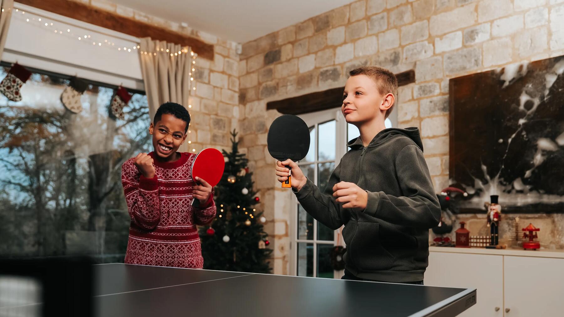 man and woman playing ping pong