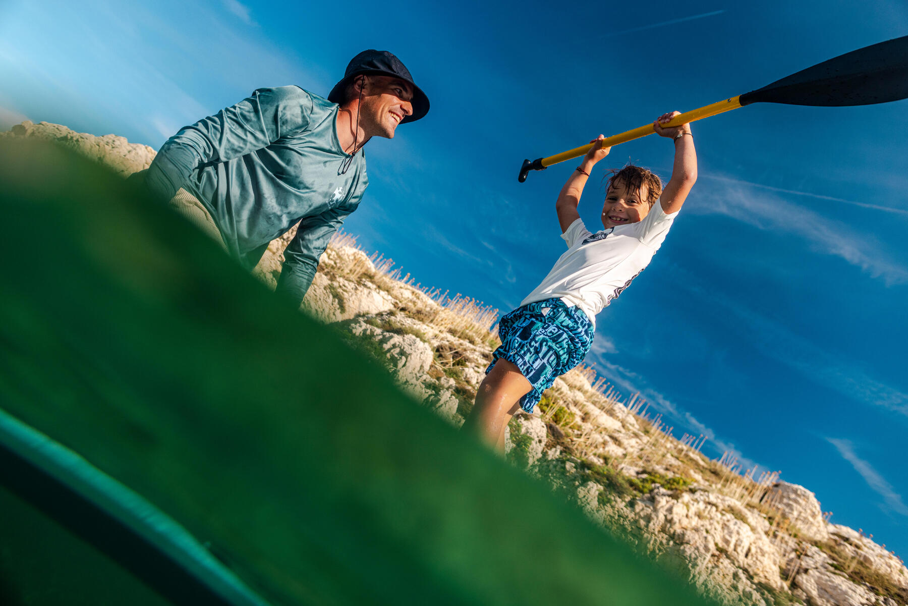 two people paddling on a lake