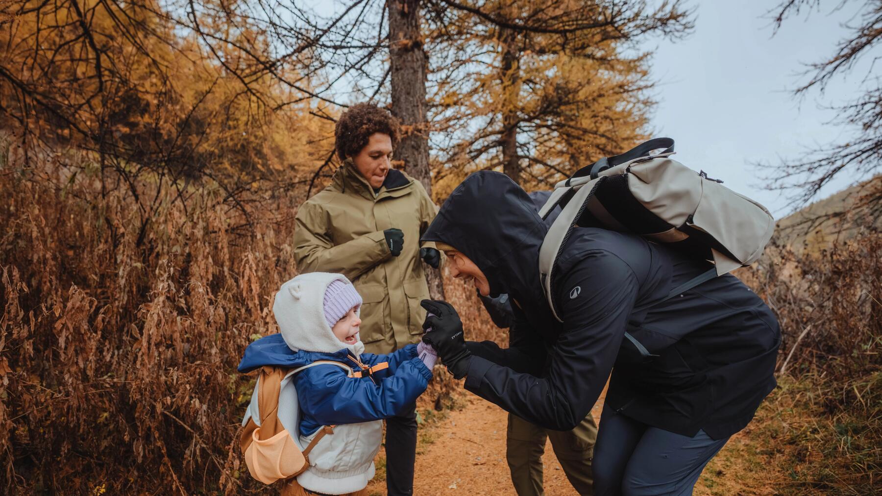 adults and kids with hiking backpacks