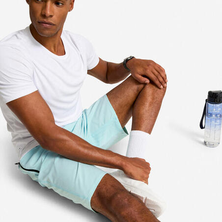 Шорти чоловічі для фітнесу з кишенями на блискавці світло-сині