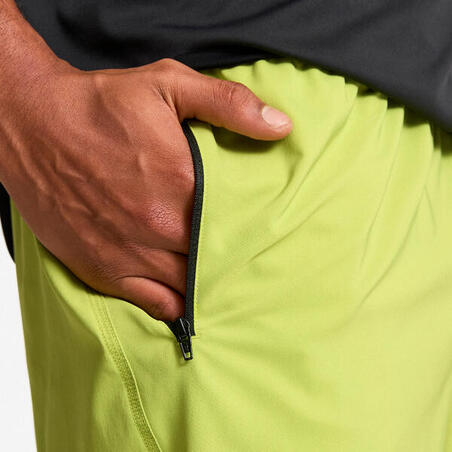 Шорти чоловічі для фітнесу з кишенями на блискавці світло-зелені