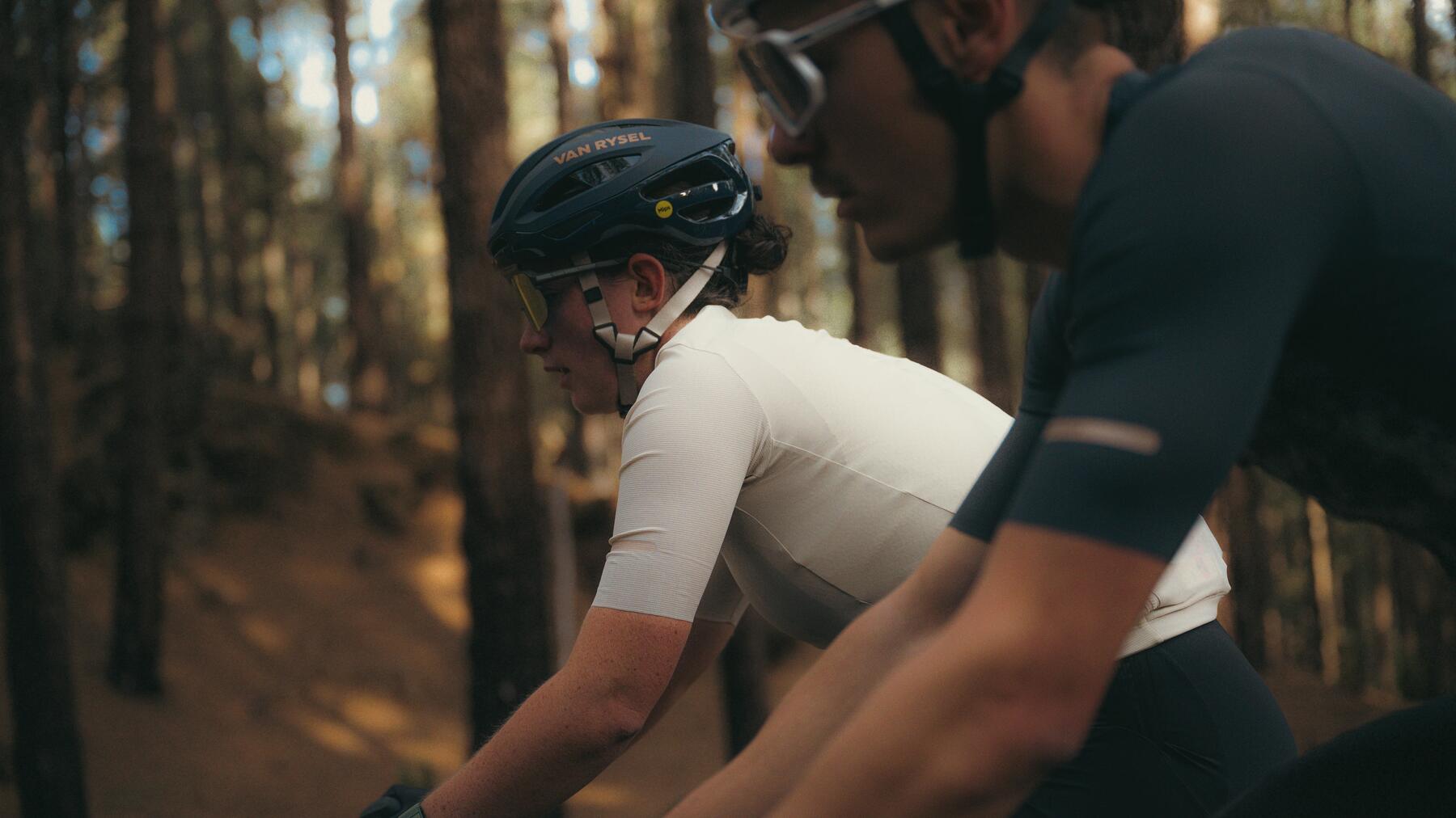 2 experienced cyclists ride at high speed 