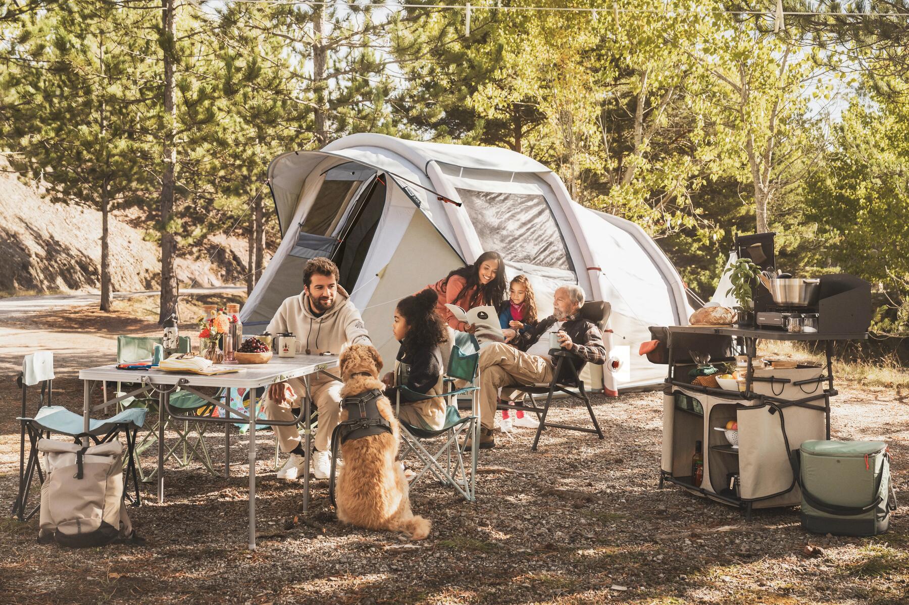 A family of campers eating inside a tent