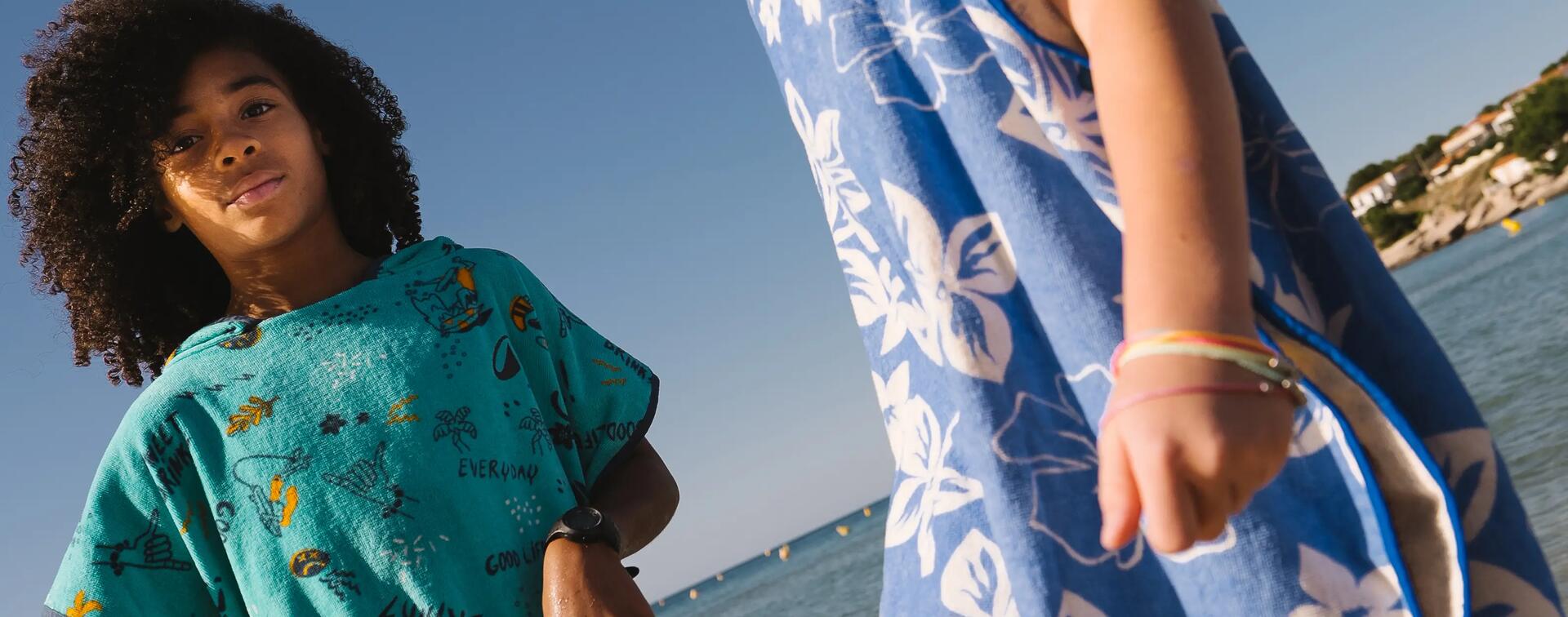 girl by the water with her surf board