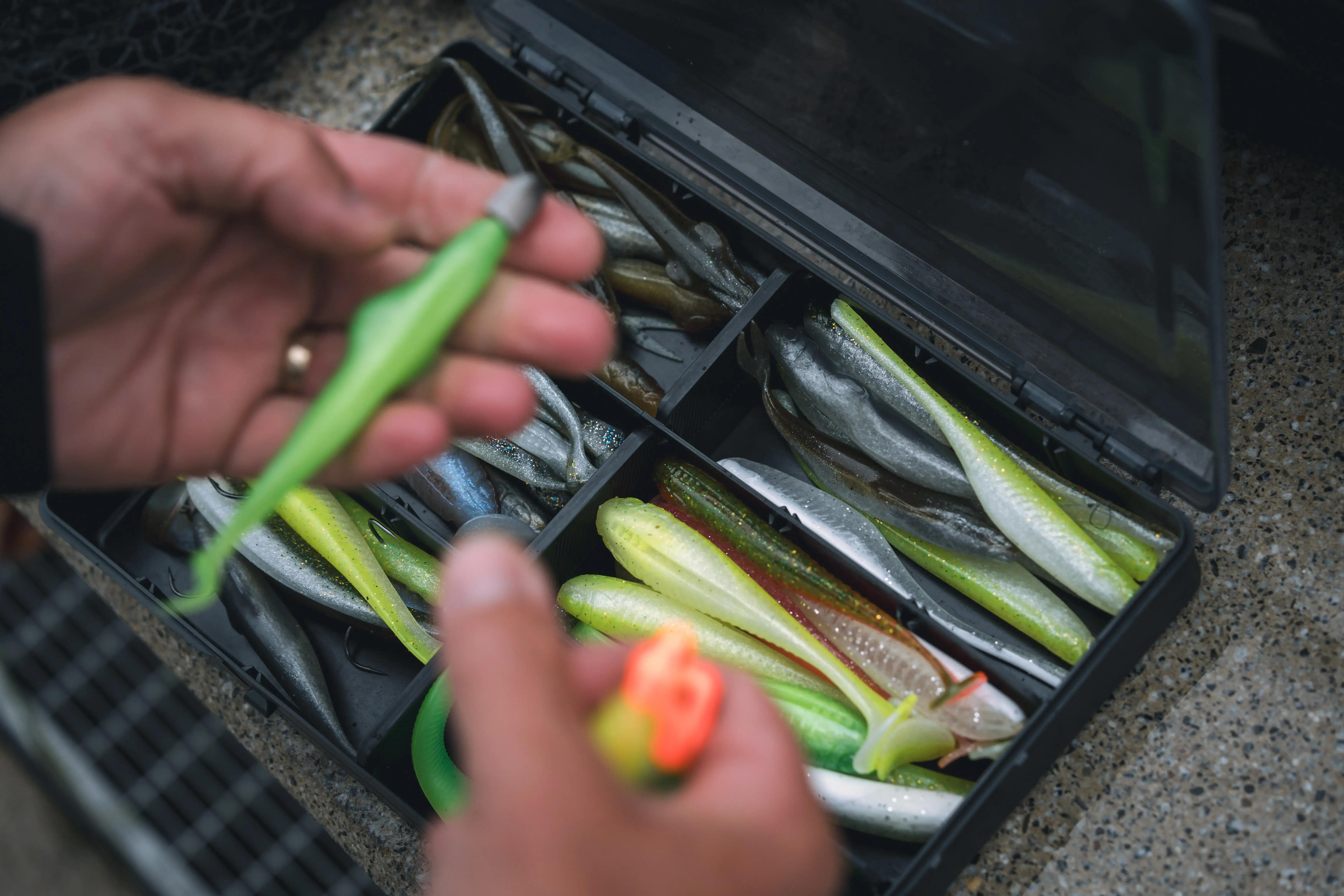 Fishing tackle box filled with soft plastic fishing lures