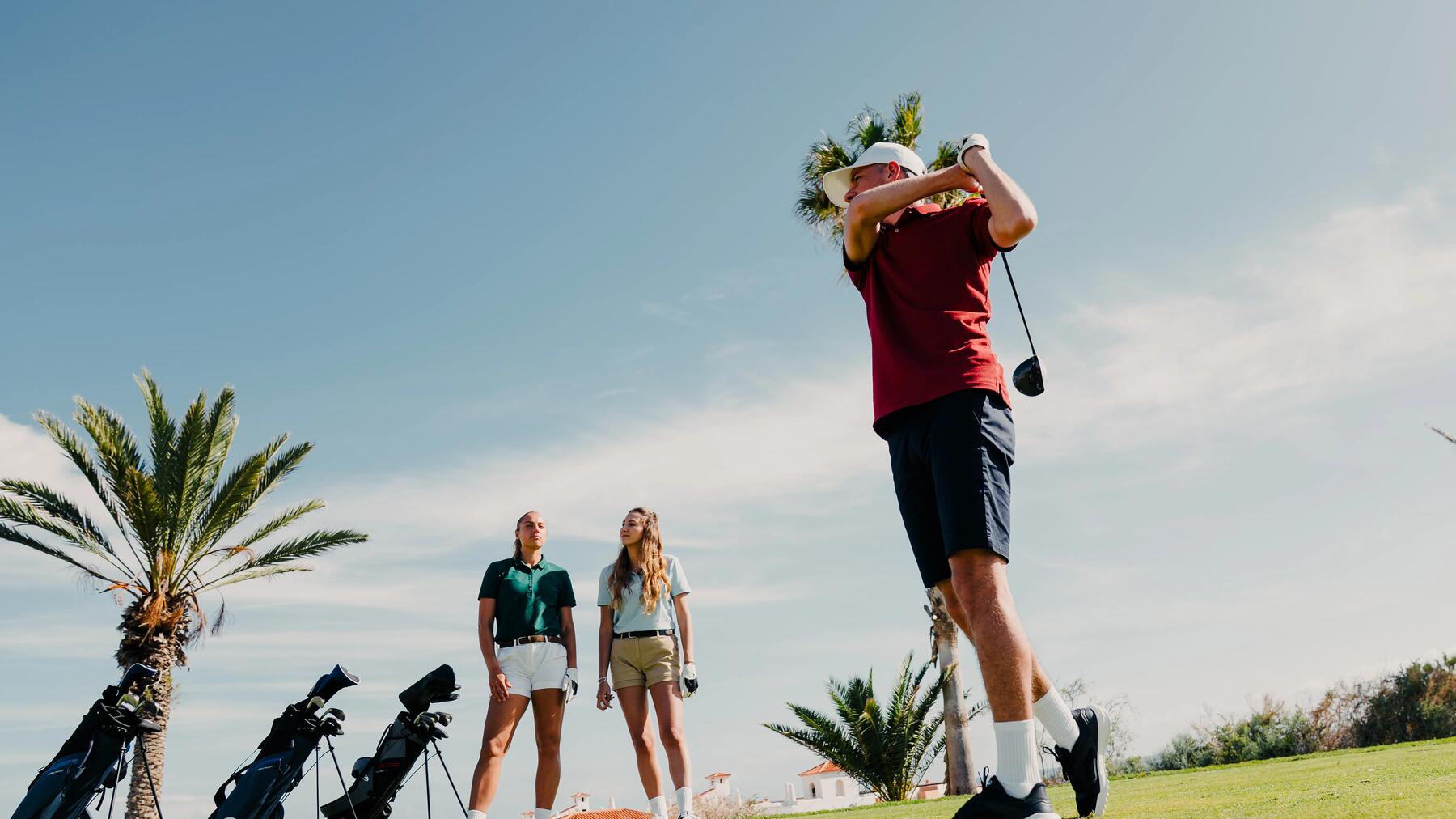 woman ready to hit her golf ball on the tee off