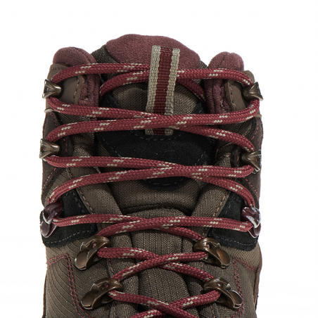 Women’s brown Forclaz 100 High waterproof hiking boots. 