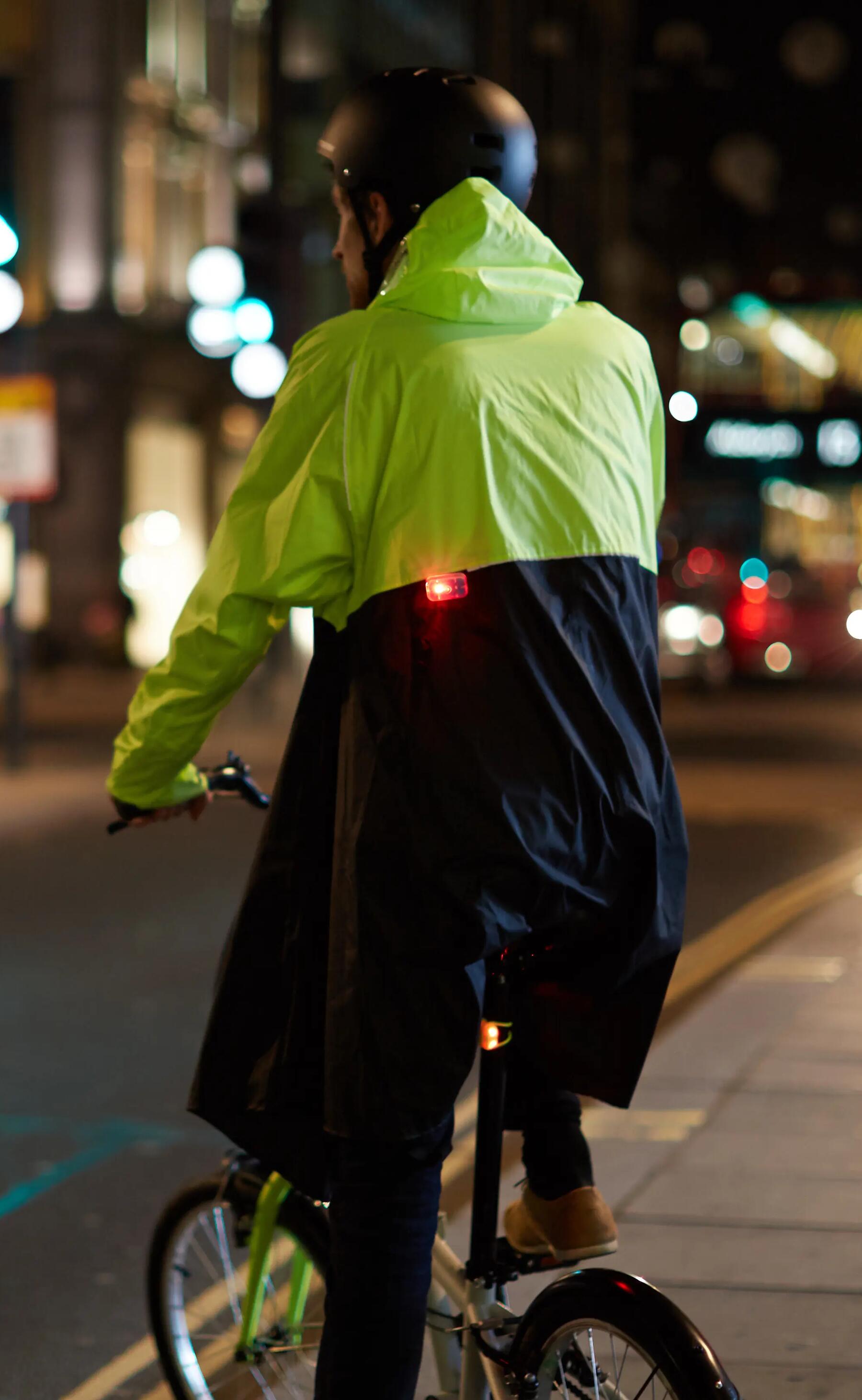 person riding a bike at night