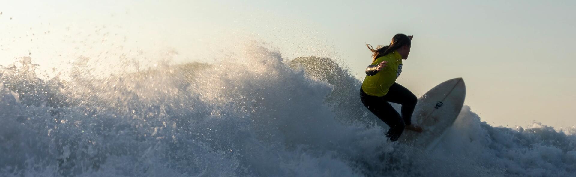 Woman riding wild wave.
