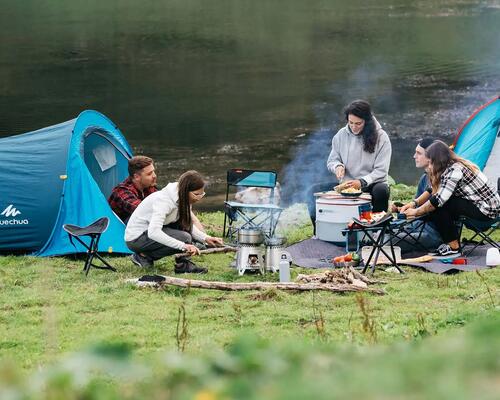 Couple eating at campsite