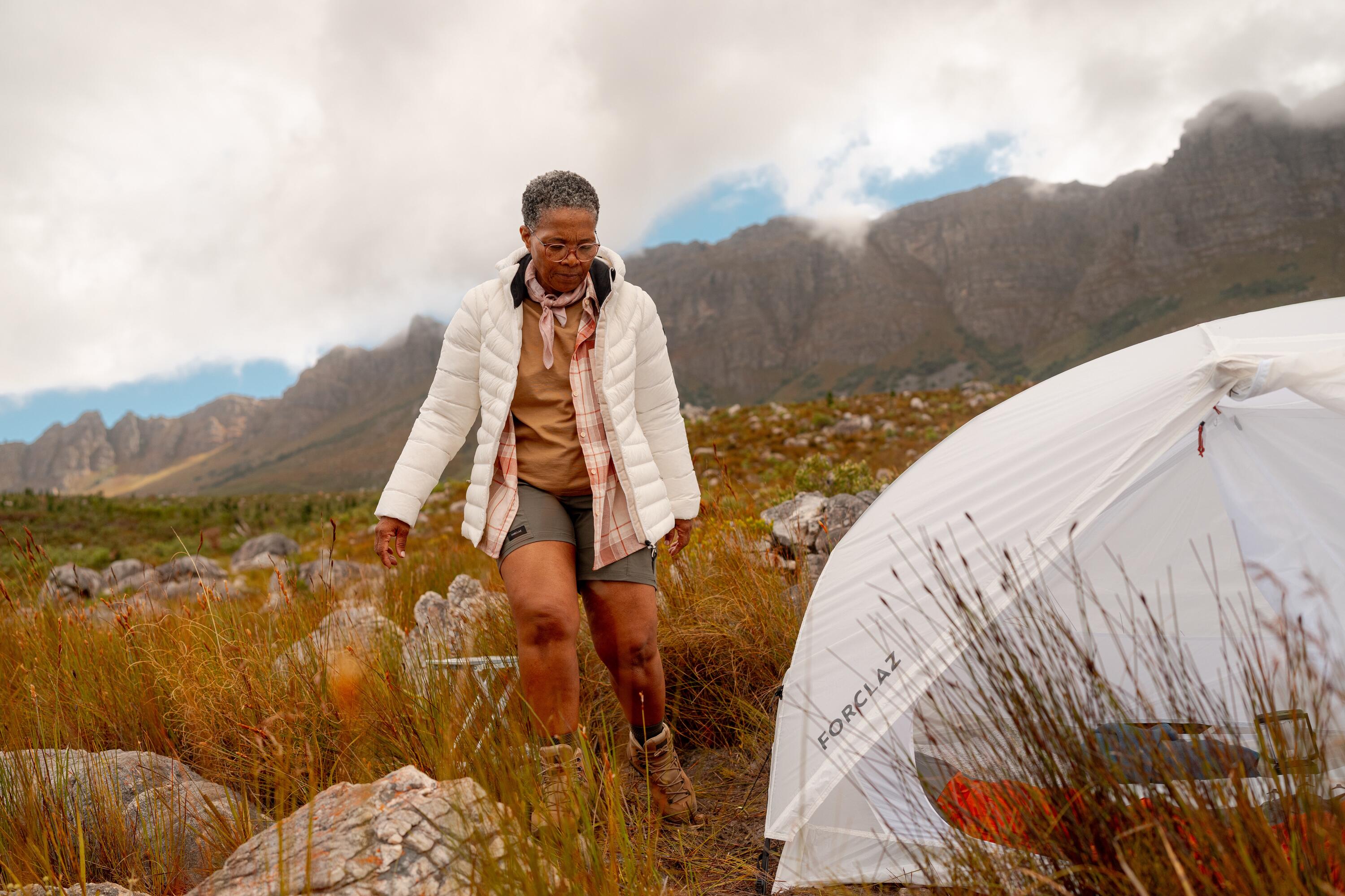 A woman camping with her tent