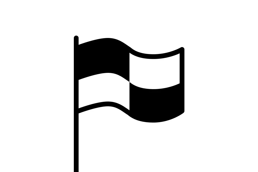 Wat betekent de zwart-wit geblokte vlag op het strand?