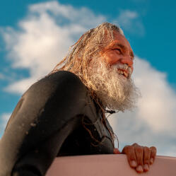 A man with a surfboard