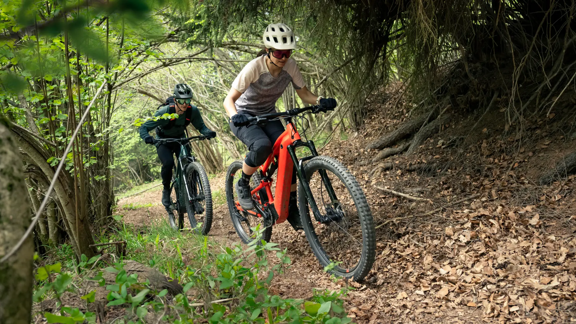 two people road cycling in the country