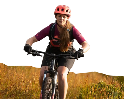 woman riding a bike at sunset