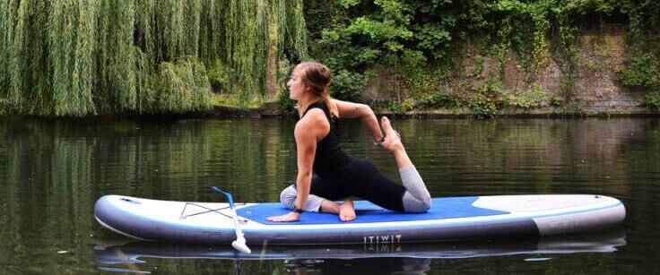 stand up paddle yoga pigeon