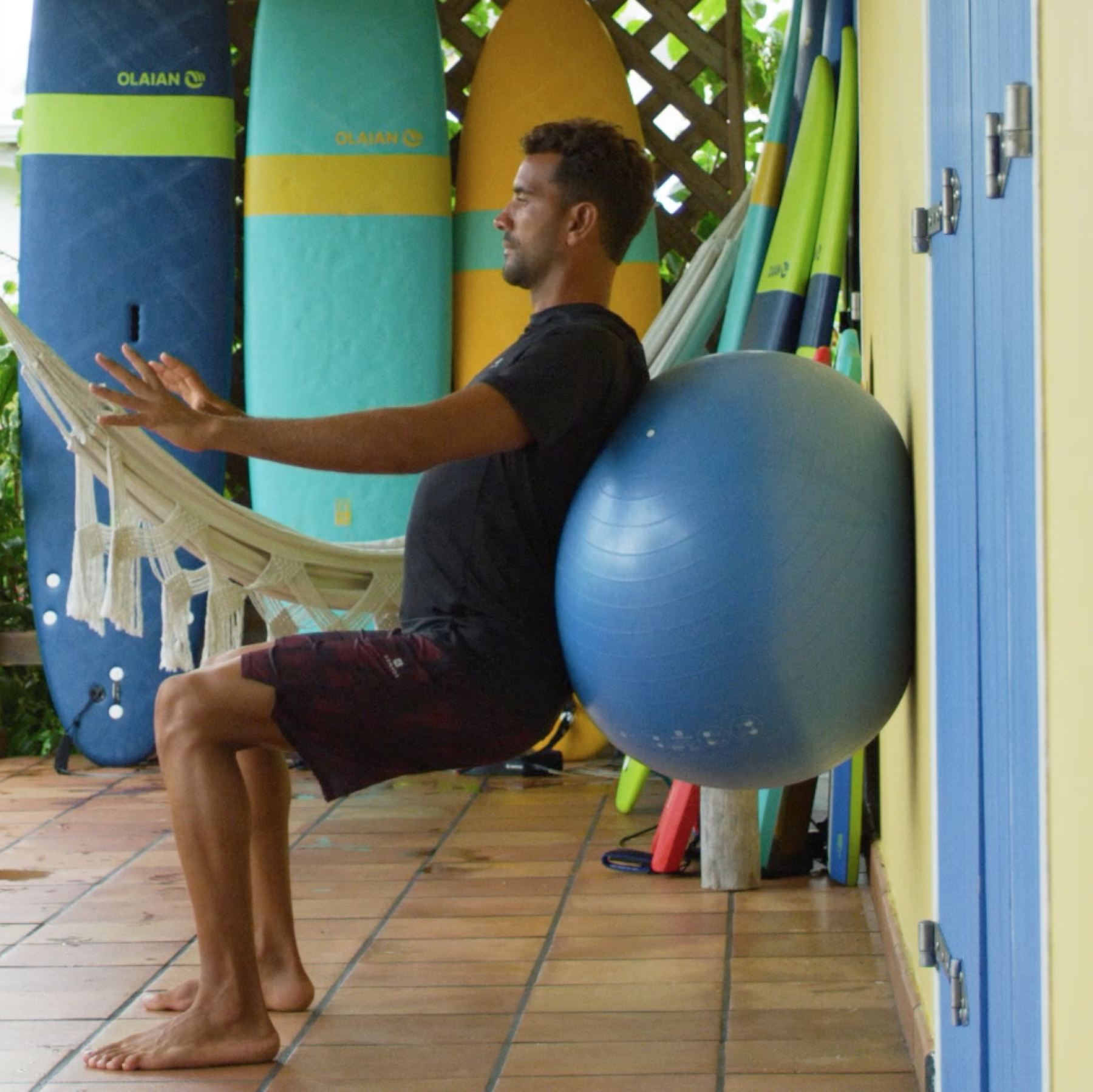 preparação física surfista cadeira agachamento