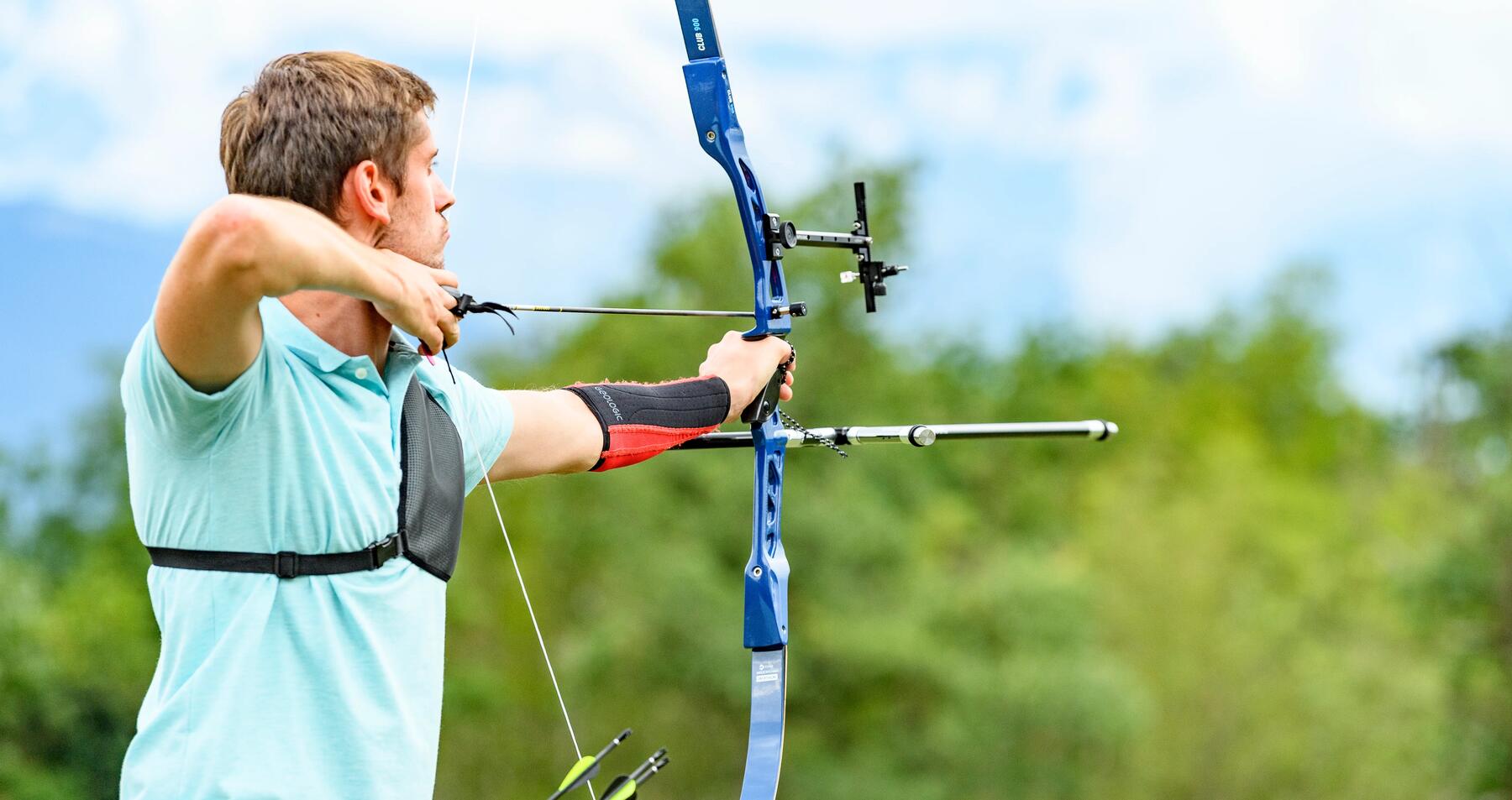 Man using archery bow and arrow