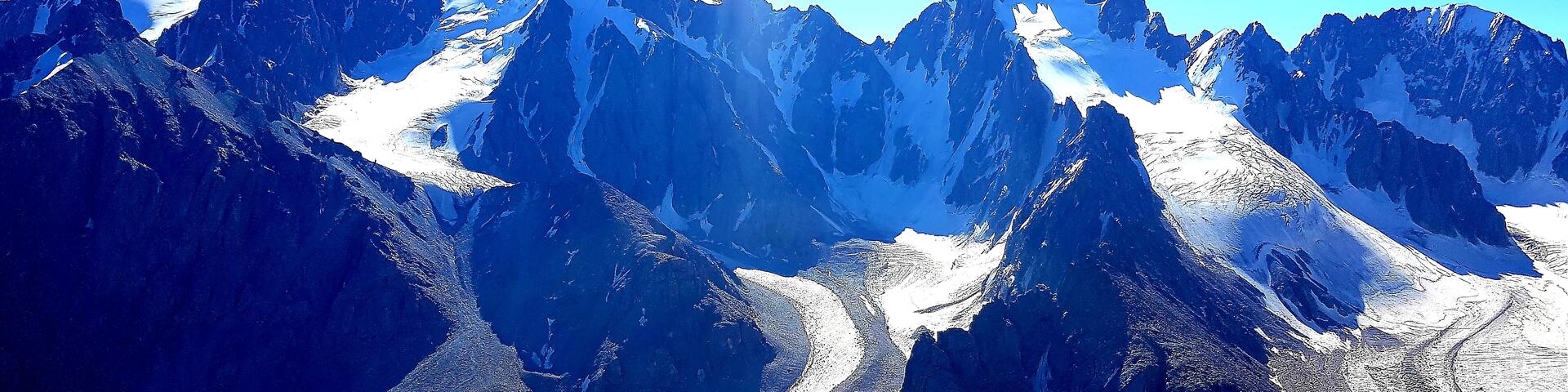 Image of snowy mountains in the sun