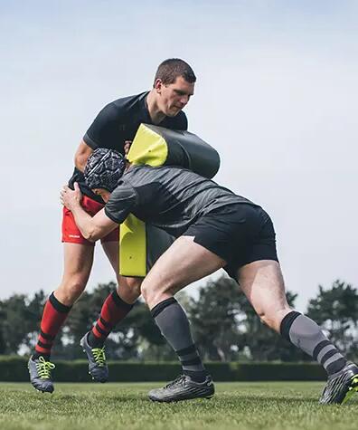 Rugby tackle practice with pads