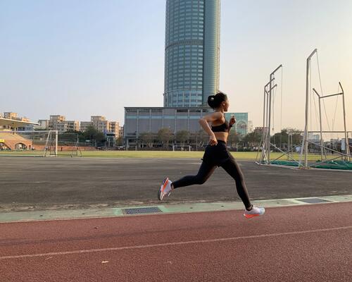 Woman running track