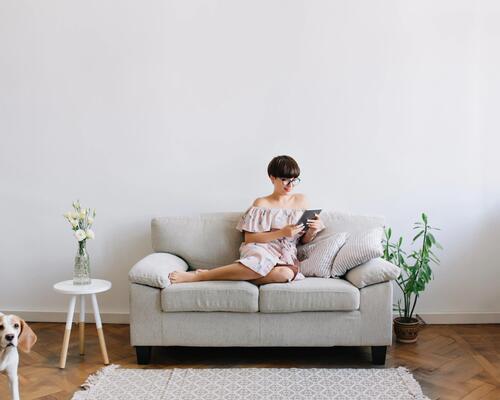 woman relaxing on her couch