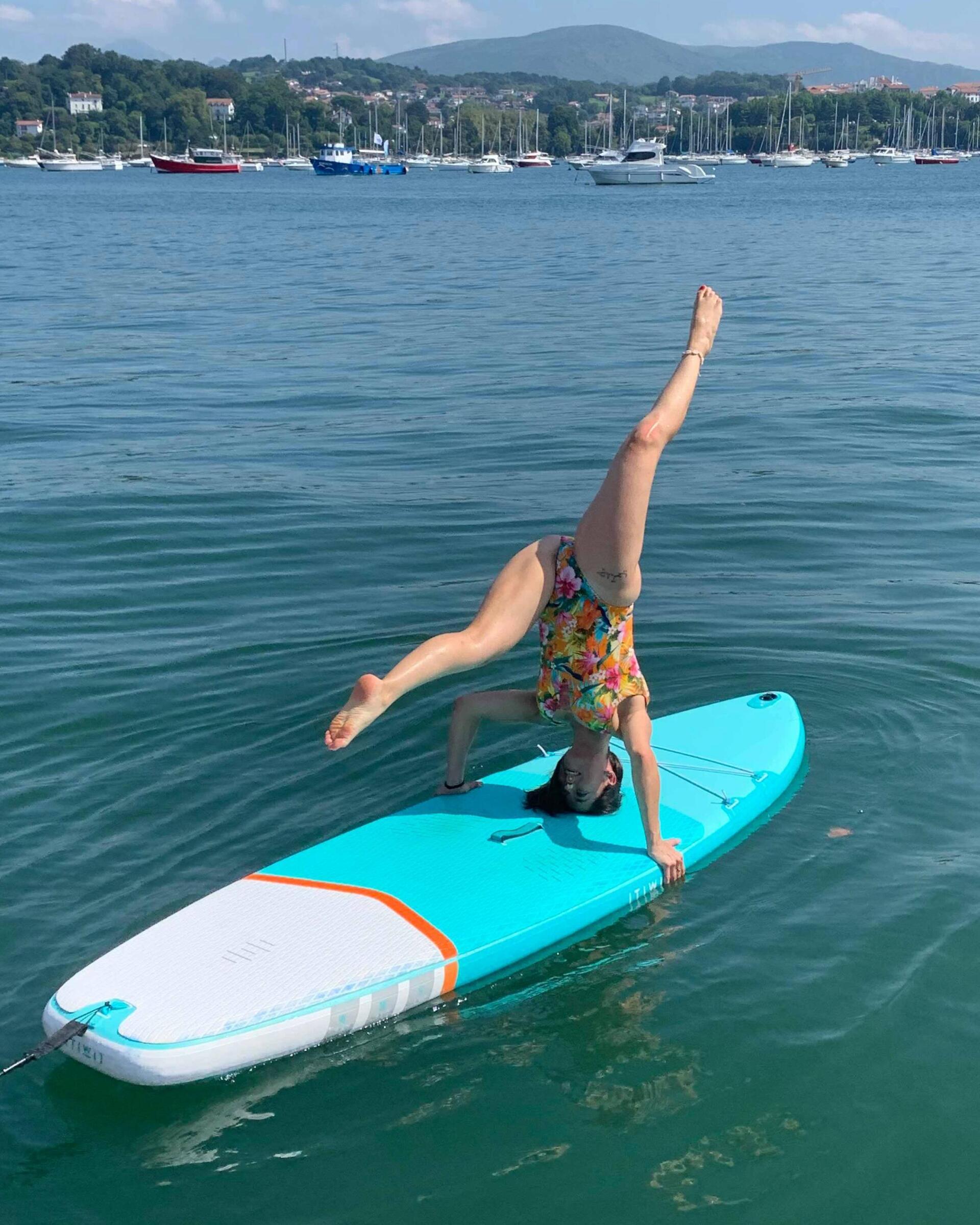Doing pilates on a stand-up paddle (sup) board