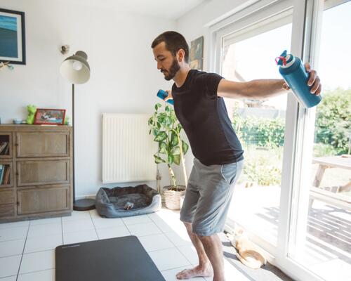 man stretching at home