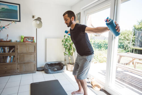man stretching at home