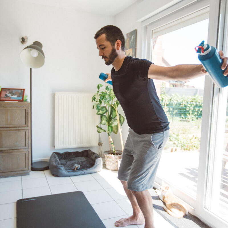 man stretching at home