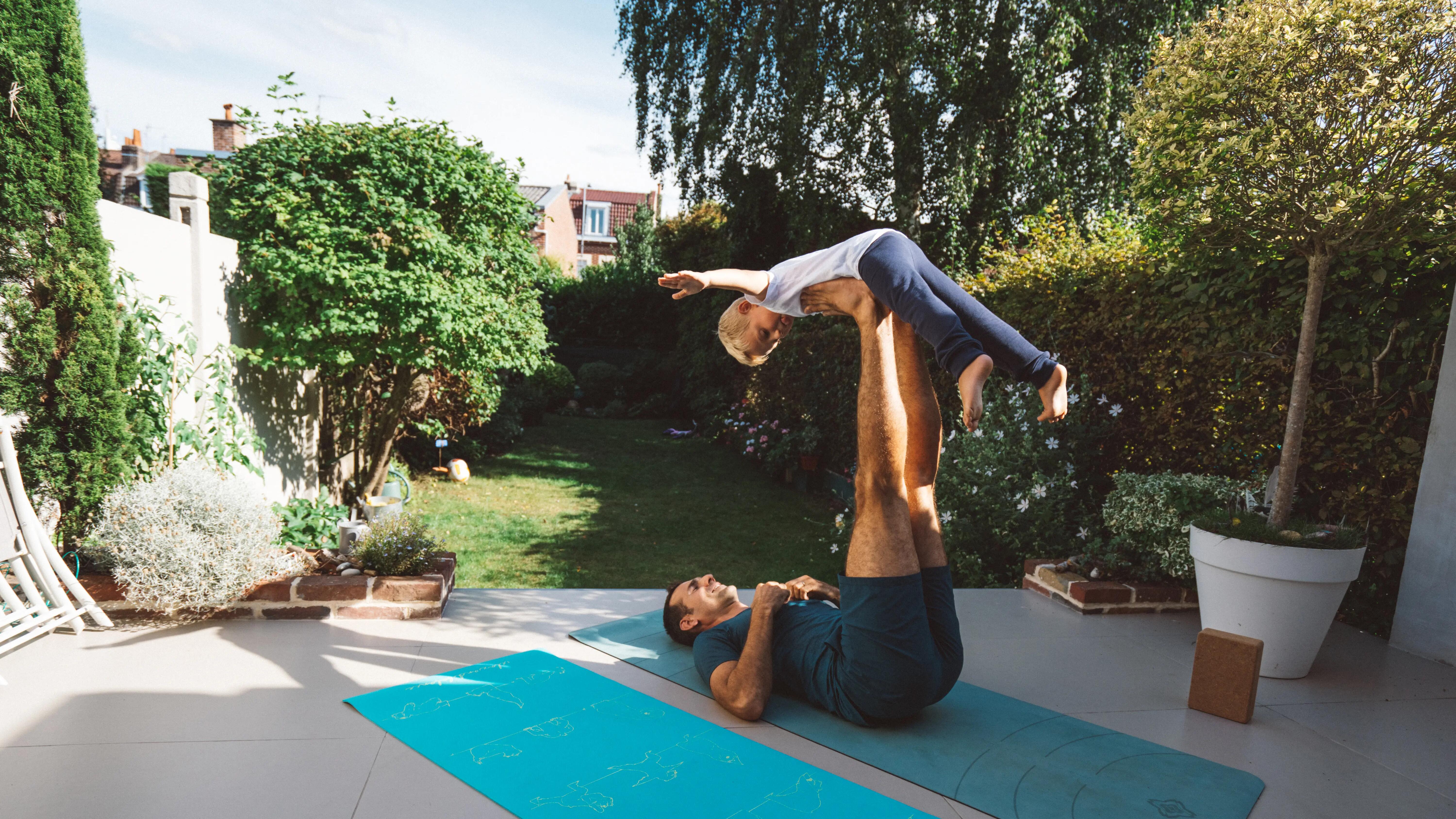 father and son doing yoga