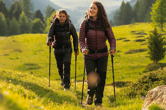 Image of womens hiking and trekking on a mountain