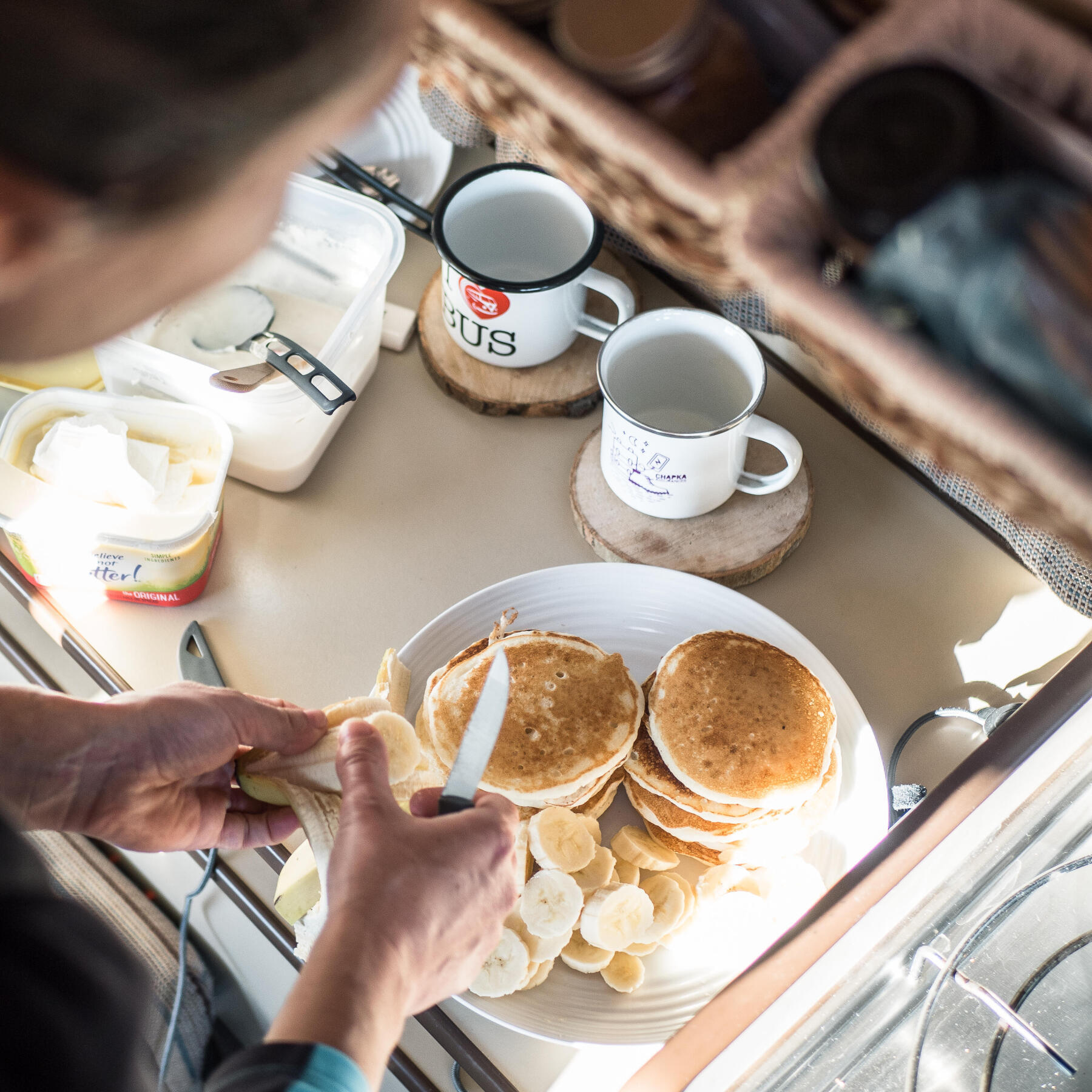 making banana pancakes in a camper van