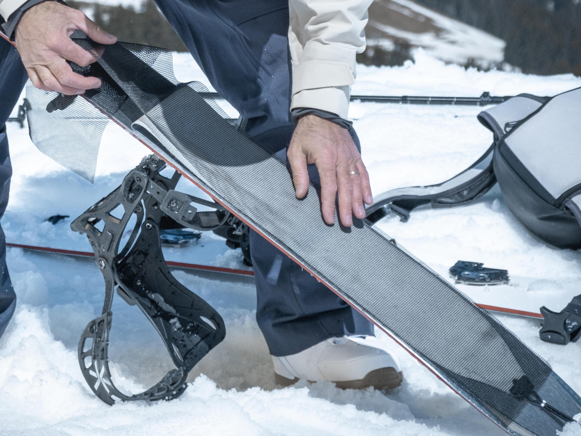 How do you put on and take off your skins when splitboarding?