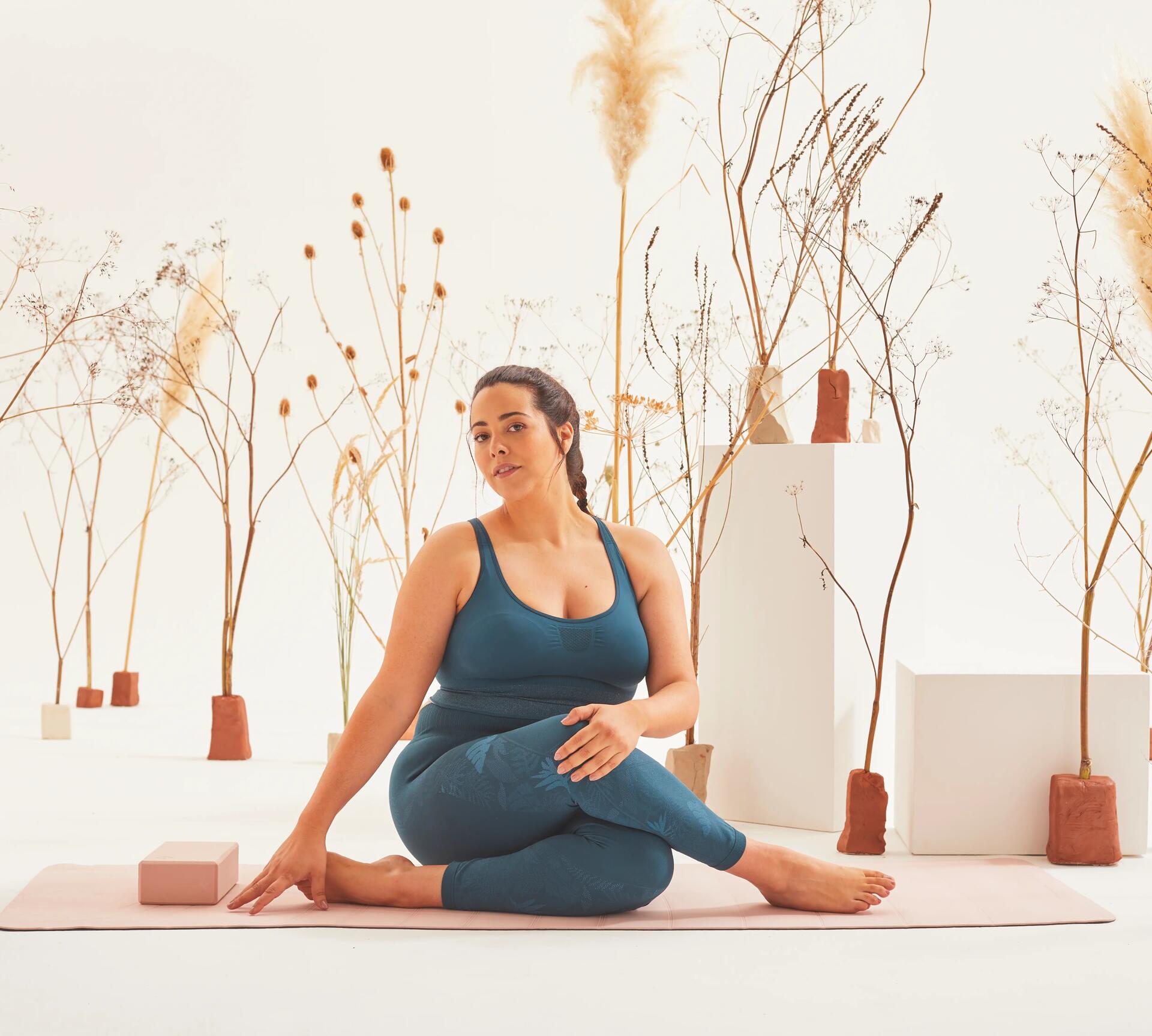 woman doing cross-legged yoga pose