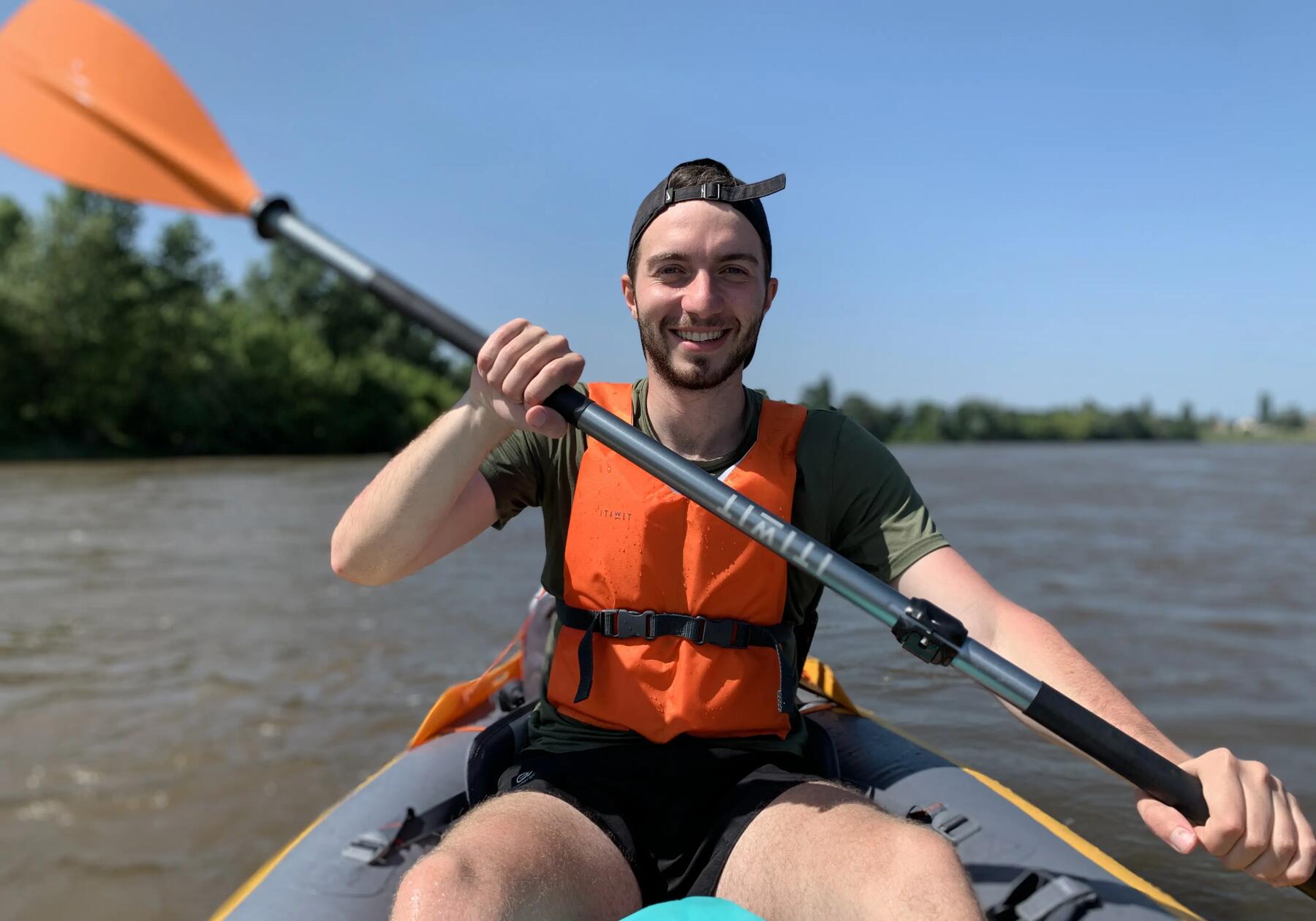 Two people paddling in a tandem kayak